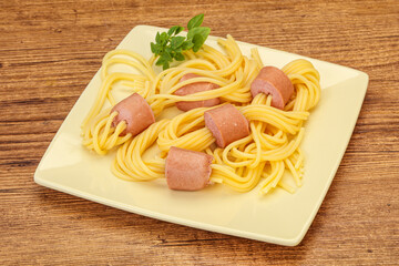 Kids pasta spaghetti with sausages