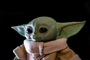 Naklejka premium DECEMBER 2020: The Child, Grogu or baby Yoda, fictional character from the TV series The Mandalorian.