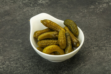 Pickled gherkin in the bowl