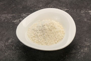 Wheat flour heap in the bowl