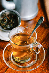 Transparent cup of green tea