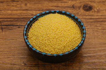 Raw cous cous heap in the bowl