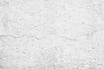 Texture of a concrete wall with cracks and scratches which can be used as a background