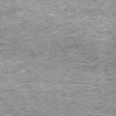 Cardboard black abstract texture close-up. Dark old paper background. Grunge concrete wall. Vintage blank wallpaper.