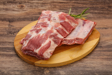 Fototapeta premium Raw pork ribs served rosemary