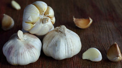 Garlic on old wooden background