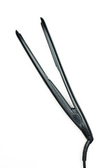 Hair iron on white background. Black hair straightener. Electric curling iron hair straightener