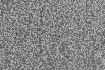 Cardboard black abstract texture close-up. Dark old paper background. Grunge concrete wall. Vintage blank wallpaper.