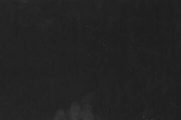 Fototapeta na wymiar Cardboard black abstract texture close-up. Dark old paper background. Grunge concrete wall. Vintage blank wallpaper.