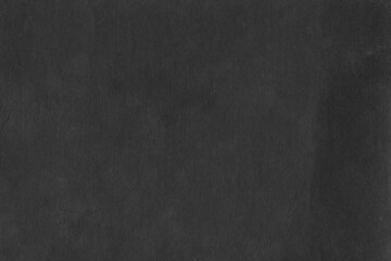 Cardboard black abstract texture close-up. Dark old paper background. Grunge concrete wall. Vintage blank wallpaper.