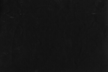 Cardboard black abstract texture close-up. Dark old paper background. Grunge concrete wall. Vintage blank wallpaper.