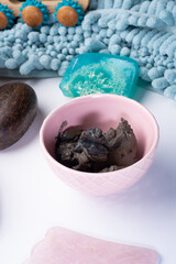 natural   spa set with healing mud and soap on white  background. close up