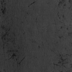 Cardboard black abstract texture close-up. Dark old paper background. Grunge concrete wall. Vintage blank wallpaper.