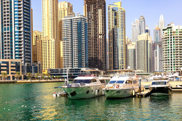 Fototapeta na wymiar Dubai Marina Bay with yachts. United Arab Emirates Dubai March 2019