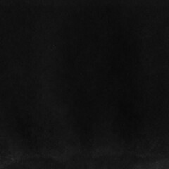 Cardboard black abstract texture close-up. Dark old paper background. Grunge concrete wall. Vintage blank wallpaper.