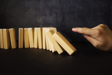 The child plays with wooden sticks, holds with his hand. The concept of training and education of young children.