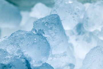 Ice cubes as background texture closeup photo