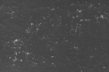 Cardboard black abstract texture close-up. Dark old paper background. Grunge concrete wall. Vintage blank wallpaper.