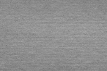 Cardboard black abstract texture close-up. Dark old paper background. Grunge concrete wall. Vintage blank wallpaper.