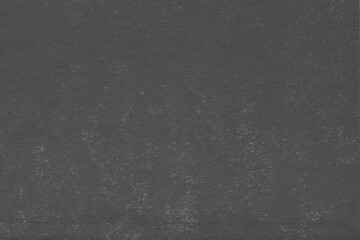 Cardboard black abstract texture close-up. Dark old paper background. Grunge concrete wall. Vintage blank wallpaper.