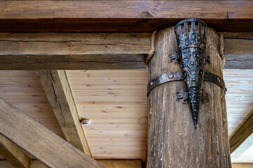 Ancient torch. Wooden interior. Elements of decor in the old style.
