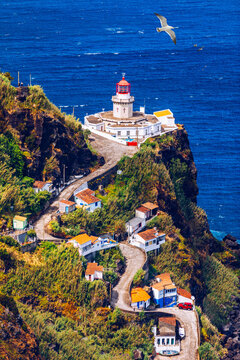 Dramatic view down to lighthouse on Ponta do Arnel, Nordeste, Sao Miguel Island, Azores, Portugal. Lighthouse Arnel near Nordeste on Sao Miguel Island, Azores, Portugal.