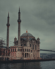 Fototapeta na wymiar Ortaköy Mosque together with 15 July Martyrs Bridge