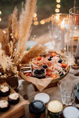 atmospheric candle decor with live fire on the banquet table