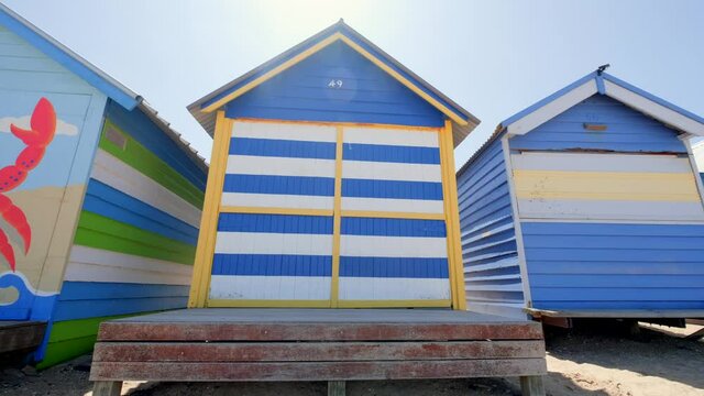 Brighton Beach huts/boxes on a blue sky sunny day with bright colours and textures
