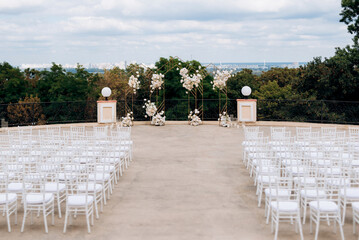 wedding ceremony area, arch chairs decor