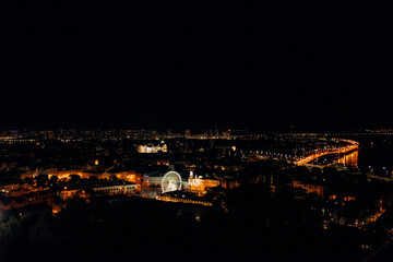 Fototapeta na wymiar night landscape of the city of kiev glowing with lights