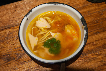 Homemade Russian noodle and chicken soup served in a Soviet era enameled bowl, Saint Petersburg, Russia