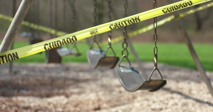Midwest United States of America Public Park Chain Swing Set Blocked and Wrapped in Yellow Caution Tape in 2020