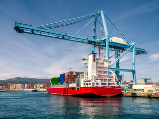 Container ship in the portof Algeciras, Spain loading and unloading containers
