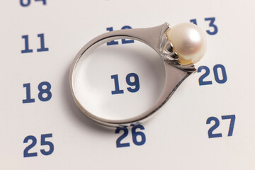 women ring on the calendar intended to remember an event