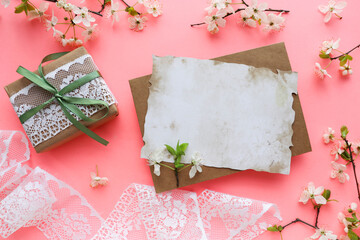 spring background. layout of a postcard from a blossoming cherry branch and an envelope. space for text