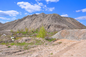 A mountain of waste rock in a quarry