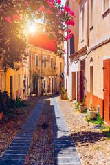 Fototapeta premium Alghero old town, Alghero street view on a beautiful day. Alghero, Italy. Panoramic aerial view of Alghero, Sardinia, Italy.