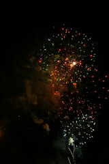 Colorful fireworks set on the dark black nite sky background