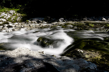 Mountain river water landscape - a refreshing and cold mountain river near a hiking trail in the bavarian alps - wild river water texture - Aschau Im Chiemgau, Bavaria, Germany, Europe