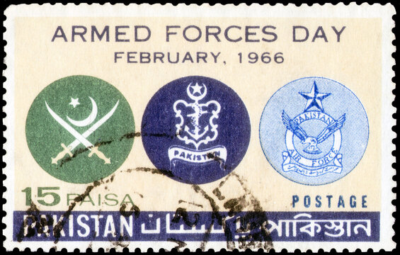 Postage stamp issued in the Pakistan with the image of the Army, Navy and Air Force Crests. From the series on Armed Forces Day, circa 1966