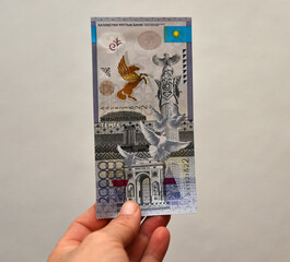 some tenge banknotes from the country of kazakhstan