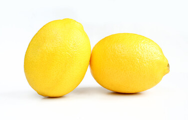 Two lemons isolated on white background. Close up fruits