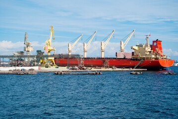 Fototapeta premium An empty cargo ship stands for loading containers for import.