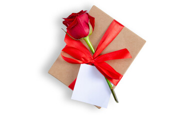 Gift box with red ribbon and red rose, white card on white background