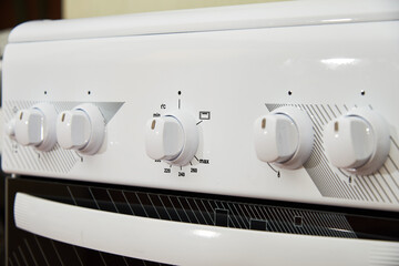 Control knobs on gas burners stove hob in the kitchen