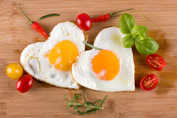 Fried eggs in the shape of a heart.