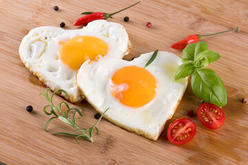 Fried eggs in the shape of a heart.