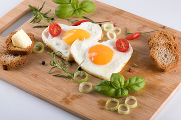 Fried eggs in the shape of a heart.
