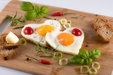 Fried eggs in the shape of a heart.